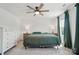 Inviting bedroom featuring a ceiling fan, dresser, and natural light from the window at 637 Scotch Meadows Loop, Monroe, NC 28110