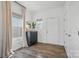 Bright entryway featuring hardwood floors, a stylish console table, and a white door with silver hardware at 637 Scotch Meadows Loop, Monroe, NC 28110
