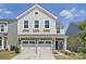 Charming two-story home featuring a stone facade, attached two-car garage, and well-maintained landscaping at 637 Scotch Meadows Loop, Monroe, NC 28110