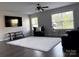 Spacious living room with natural light, dark laminate floors, a large rug, and contemporary furniture at 6518 Blackwood Ln, Waxhaw, NC 28173