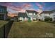 Spacious backyard with green lawn, swing set and a black fence perfect for outdoor activities and Gathering fun at 660 Daventry Ct # 35, Clover, SC 29710