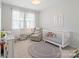 Bright Bedroom with a crib, chair, and area rug is ready for a little one at 660 Daventry Ct # 35, Clover, SC 29710