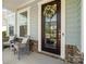 Inviting front porch with seating and decorative wreath, creating a welcoming entrance to the home at 660 Daventry Ct # 35, Clover, SC 29710