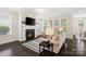 Cozy living room featuring a fireplace and large windows offering abundant natural light for relaxation at 660 Daventry Ct # 35, Clover, SC 29710