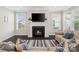 Comfortable living room with fireplace and large windows providing bright natural light for relaxation and comfort at 660 Daventry Ct # 35, Clover, SC 29710