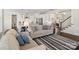 Open-concept living room with a fireplace and ample seating, ideal for relaxing and entertaining guests at 660 Daventry Ct # 35, Clover, SC 29710