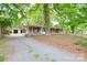 A well maintained brick home with mature trees and detached garage at 7224 Kuck Rd, Mint Hill, NC 28227