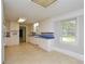 A bright kitchen features white cabinets and eye-catching blue tile countertops at 7224 Kuck Rd, Mint Hill, NC 28227