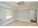 A bright kitchen featuring paneled walls and neutral flooring at 7224 Kuck Rd, Mint Hill, NC 28227