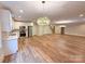 Wide open finished basement with a wet bar, stainless appliances, and access to the stairway at 724 Ideal Way, Charlotte, NC 28203