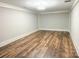 Finished basement area, ready for customization, with wood flooring and ample lighting at 724 Ideal Way, Charlotte, NC 28203