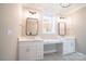 Bathroom with dual vanity, sleek mirrors and fixtures, and ample counter space at 724 Ideal Way, Charlotte, NC 28203