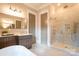 Bathroom featuring glass shower and double sink vanity at 724 Ideal Way, Charlotte, NC 28203
