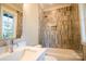 Well-lit bathroom features a modern vanity and tiled shower with tub at 724 Ideal Way, Charlotte, NC 28203