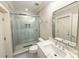 Modern bathroom featuring glass shower enclosure, stylish fixtures, and vanity with white countertop at 724 Ideal Way, Charlotte, NC 28203