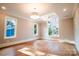 Spacious bedroom with hardwood floors, large windows, and modern lighting at 724 Ideal Way, Charlotte, NC 28203