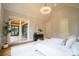 Primary bedroom featuring backyard access, vaulted ceilings, and luxury decor at 724 Ideal Way, Charlotte, NC 28203