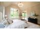 This bedroom has a large window, exterior access, decor, and a large bed at 724 Ideal Way, Charlotte, NC 28203
