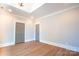 Spacious bedroom featuring hardwood floors and a double door closet at 724 Ideal Way, Charlotte, NC 28203
