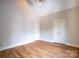 Bedroom with wood floors, pitched ceilings, and a modern light fixture at 724 Ideal Way, Charlotte, NC 28203