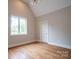 Bedroom featuring hardwood floors, pitched ceilings and bright natural light at 724 Ideal Way, Charlotte, NC 28203