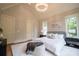 This bedroom has a decorative ceiling lamp, large bed, an area rug, and great natural light at 724 Ideal Way, Charlotte, NC 28203