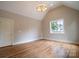 Bright bedroom featuring hardwood floors, pitched ceilings and natural light at 724 Ideal Way, Charlotte, NC 28203