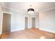 Bedroom showcasing hardwood floors, recessed lighting, and three paneled doors at 724 Ideal Way, Charlotte, NC 28203