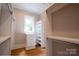 Walk-in closet with custom shelving units, cabinets, drawers, and hanging rods at 724 Ideal Way, Charlotte, NC 28203