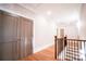 Bright hallway features hardwood floors, neutral walls, and classic trim at 724 Ideal Way, Charlotte, NC 28203