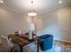 Light filled home office with neutral paint, hardwood floors, stylish light fixture, and a live edge wood desk at 724 Ideal Way, Charlotte, NC 28203