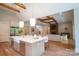 Open concept kitchen with large island, stainless steel appliances, hardwood floors, and open to living area at 724 Ideal Way, Charlotte, NC 28203