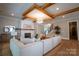 Comfortable living room featuring a fireplace, timber ceiling, and access to staircase at 724 Ideal Way, Charlotte, NC 28203