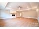 Spacious living room featuring hardwood floors and a fireplace at 724 Ideal Way, Charlotte, NC 28203