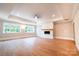 Bright living room with fireplace, hardwood floors, and large windows at 724 Ideal Way, Charlotte, NC 28203