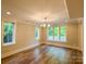 Bright living room featuring hardwood floors, recessed lighting and plenty of natural light at 724 Ideal Way, Charlotte, NC 28203