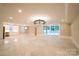 Expansive living room with tile flooring, modern lighting, and access to outdoor patio at 724 Ideal Way, Charlotte, NC 28203
