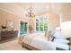 Bedroom featuring large window, light fixture, and sliding glass door to covered porch at 724 Ideal Way, Charlotte, NC 28203