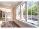 Bright sunroom with pool view, features sleek sliding glass doors and wood-look flooring at 724 Ideal Way, Charlotte, NC 28203
