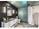 Stylish bathroom featuring a modern vanity, mosaic tile floor, skylight and a walk-in shower at 742 Lansdowne Rd, Charlotte, NC 28270