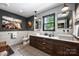 Modern bathroom featuring double sinks, modern fixtures, and decorative tile at 742 Lansdowne Rd, Charlotte, NC 28270