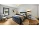 Cozy bedroom with hardwood floors, a comfortable bed, and a bright window at 742 Lansdowne Rd, Charlotte, NC 28270