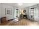 Bright room with hardwood floors, large windows with curtains, and exercise equipment at 742 Lansdowne Rd, Charlotte, NC 28270