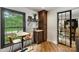 Cozy breakfast nook featuring a window with outdoor view, dining table and wood floors at 742 Lansdowne Rd, Charlotte, NC 28270