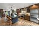 Open kitchen with a large island, stainless steel appliances, and custom cabinetry at 742 Lansdowne Rd, Charlotte, NC 28270