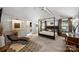 Spacious main bedroom featuring a canopy bed, elegant furnishings, and lots of natural light at 742 Lansdowne Rd, Charlotte, NC 28270