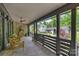 Covered patio with seating, providing a relaxing outdoor living space at 742 Lansdowne Rd, Charlotte, NC 28270