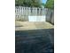 Fenced backyard features a weathered wooden deck and partial shade at 7539 Holly Grove Ct, Charlotte, NC 28227