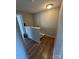 Hallway with hardwood floors and access to other rooms at 7539 Holly Grove Ct, Charlotte, NC 28227