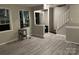 Bright living room with hardwood floors and access to the front door and staircase at 7539 Holly Grove Ct, Charlotte, NC 28227
